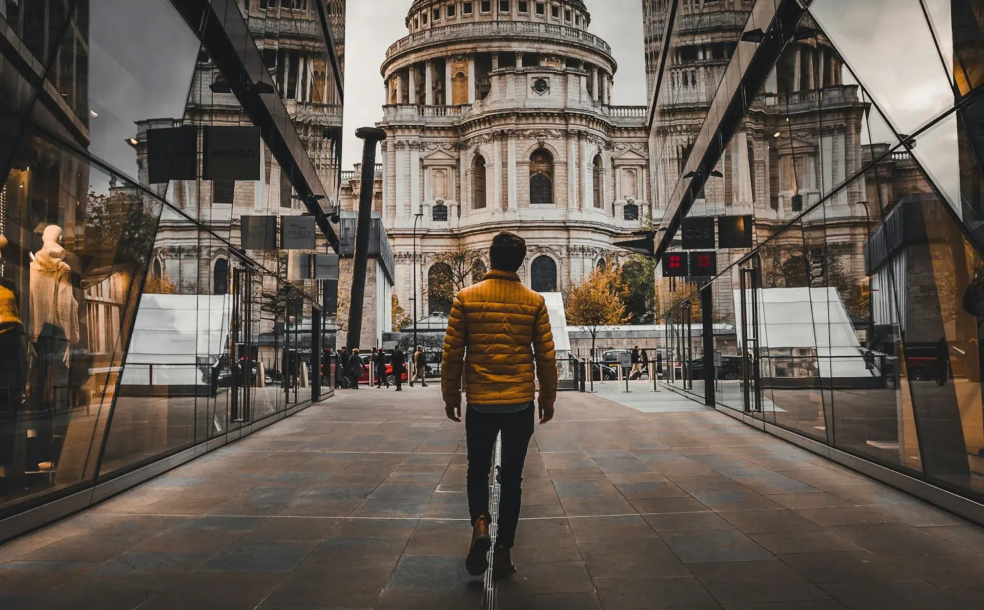 A man walking towards St Paul’s Cathedral in London